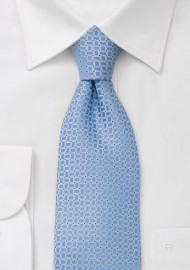 Square patterned, light blue tie