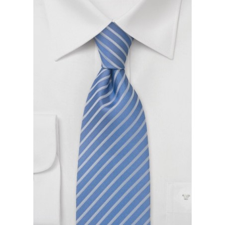 Sky blue necktie with narrow silver stripes