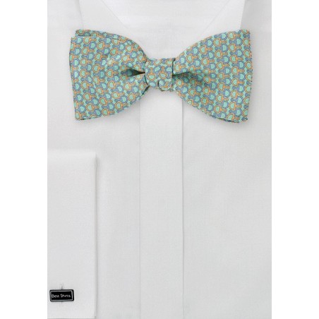 Turquoise Bowtie with Orange and Blue Pattern