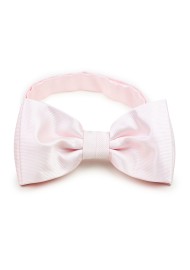 blush bow tie with ribbed texture