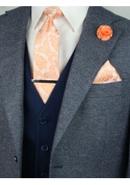 Matching peach paisley necktie and pocket square