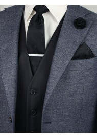 Matching black paisley necktie and pocket square