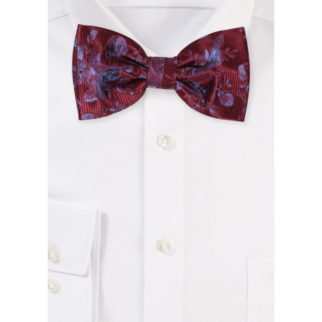 Burgundy Red Bowtie with Floral Design on a Ribbed Background