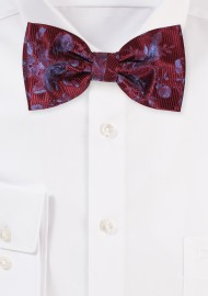 Burgundy Red Bowtie with Floral Design on a Ribbed Background